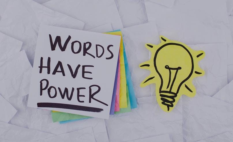A piece of paper on which a sentence is typed that says - "Words Have Power."